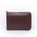 Brown vegetable-tanned leather zip folio, designed for durability and elegance, perfect for documents or a laptop.